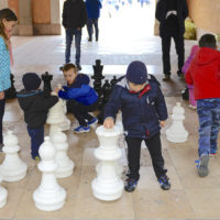 Children play with chess pieces on a chessboard near the city center in Marostica, Italy on Nov. 1, 2016. Marostica is known for its bi-annual, fall, living chess games and annual, spring, cherry festival. (U.S. Air Force photo by Staff Sgt. Krystal Ardrey/Released)